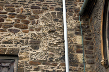 Blocked Norman window in the east wall of the south transept June 2009